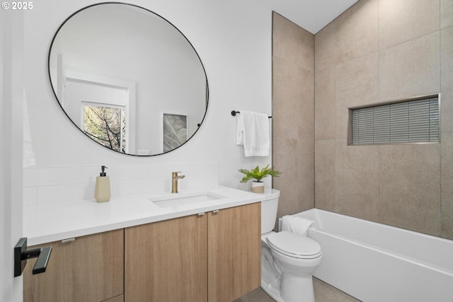 bathroom with decorative backsplash, vanity, and toilet