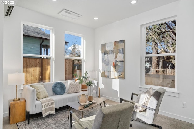 sitting room with baseboards, visible vents, and recessed lighting