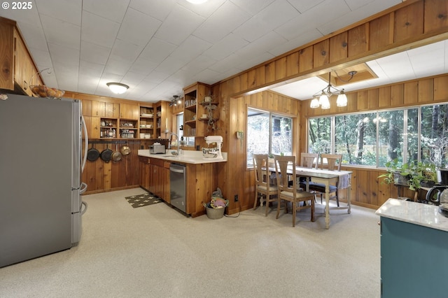 91760 Horse Creek Rd, Mckenzie Bridge, OR 97413 - kitchen featuring stainless steel appliances, wooden walls, open shelves, brown cabinets, and a sink