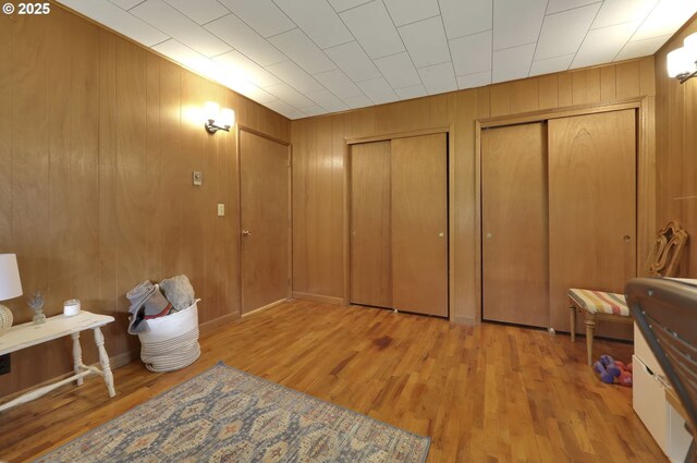 91760 Horse Creek Rd, Mckenzie Bridge, OR 97413 - bedroom with two closets, wood finished floors, and wood walls