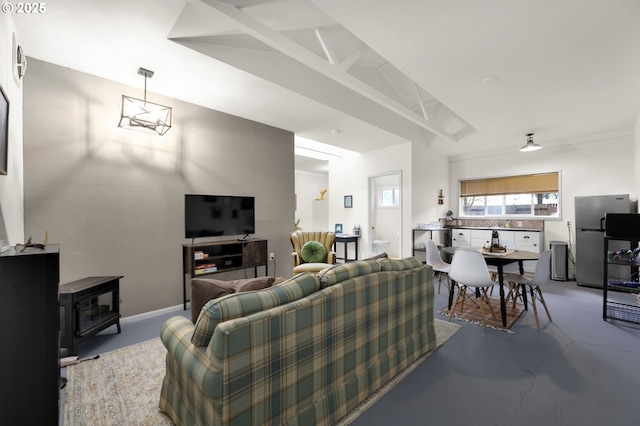 91760 Horse Creek Rd, Mckenzie Bridge, OR 97413 - living room featuring concrete flooring and a wood stove
