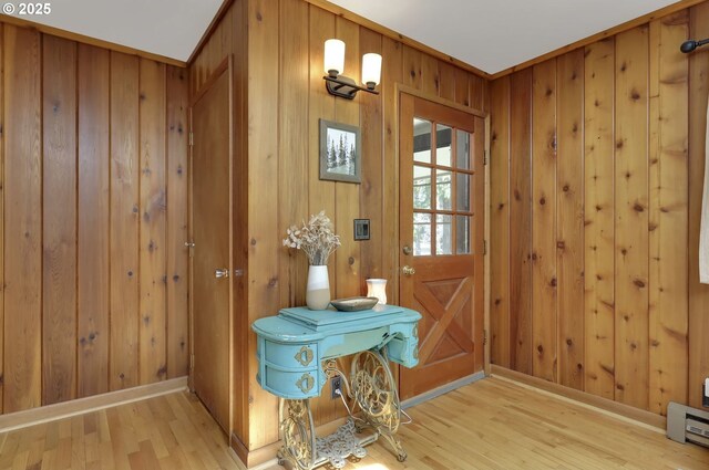 91760 Horse Creek Rd, Mckenzie Bridge, OR 97413 - entryway with light wood-style floors, wooden walls, baseboard heating, and baseboards