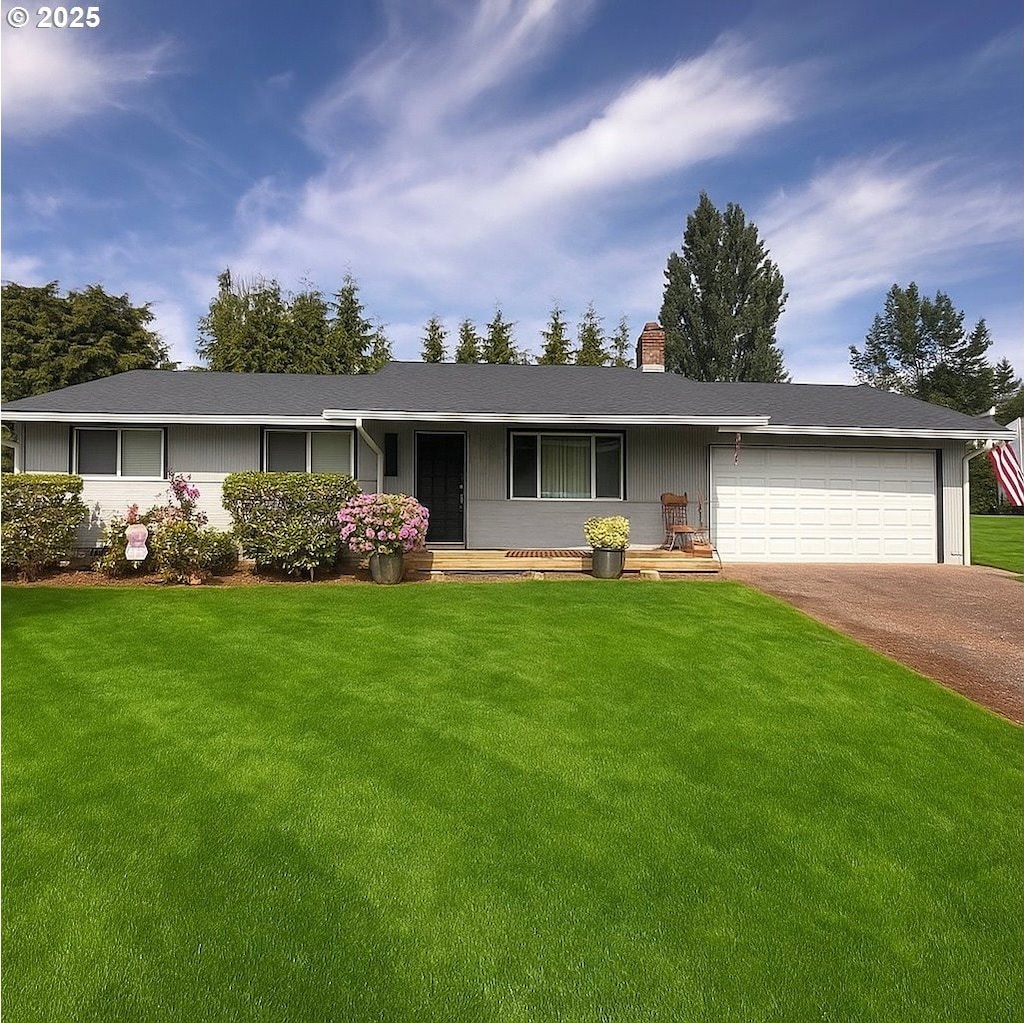 6100 NE 55th Cir, Vancouver, WA 98661 - ranch-style house featuring a chimney, an attached garage, driveway, and a front yard