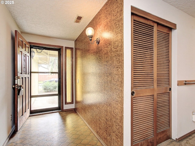 15204 NE 42nd St, Vancouver, WA 98682 - entryway featuring a textured ceiling and baseboards
