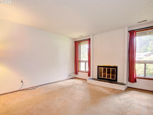 15204 NE 42nd St, Vancouver, WA 98682 - unfurnished living room featuring a fireplace, light carpet, baseboards, and a textured ceiling