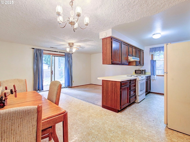 15204 NE 42nd St, Vancouver, WA 98682 - kitchen featuring white appliances, under cabinet range hood, a textured ceiling, a chandelier, and light countertops