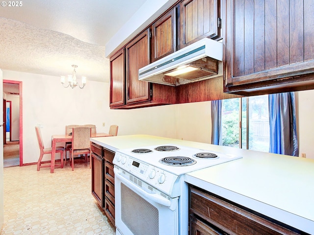 15204 NE 42nd St, Vancouver, WA 98682 - kitchen with white range with electric stovetop, range hood, light countertops, a chandelier, and a textured ceiling