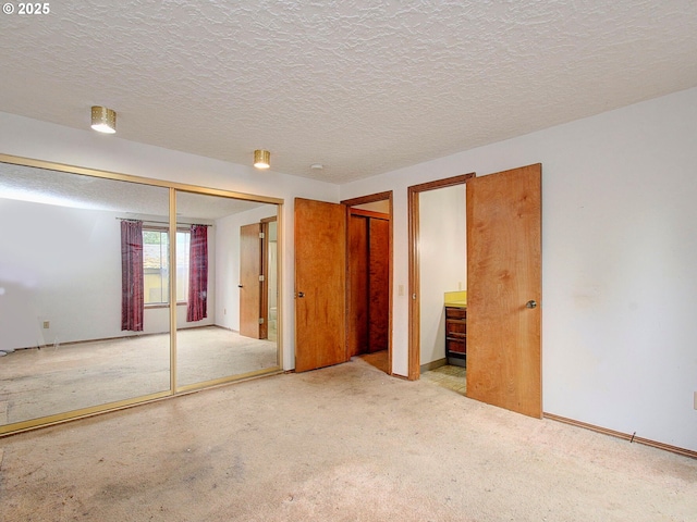 15204 NE 42nd St, Vancouver, WA 98682 - unfurnished bedroom with carpet floors, a textured ceiling, and ensuite bathroom