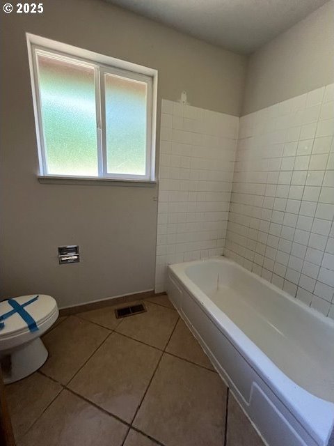 73927 Alder Grove Rd, Clatskanie, OR 97016 - bathroom with a bath, tile patterned floors, toilet, and baseboards