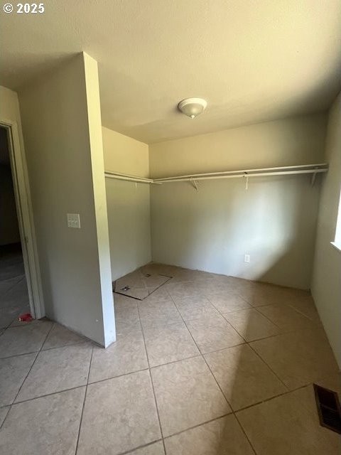73927 Alder Grove Rd, Clatskanie, OR 97016 - spacious closet featuring light tile patterned flooring