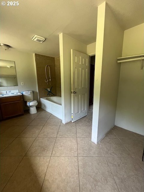 73927 Alder Grove Rd, Clatskanie, OR 97016 - bathroom with tile patterned flooring, vanity, toilet, and tub / shower combination