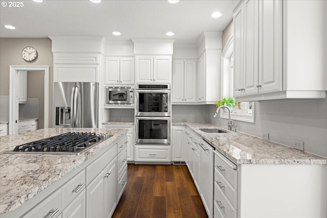 4679 Dogwood Dr, Lake Oswego, OR 97035 - kitchen with a sink, stainless steel appliances, dark wood finished floors, white cabinets, and recessed lighting