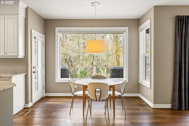 4679 Dogwood Dr, Lake Oswego, OR 97035 - dining area featuring dark wood-type flooring and baseboards