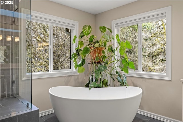 4679 Dogwood Dr, Lake Oswego, OR 97035 - bathroom featuring plenty of natural light, baseboards, and a soaking tub