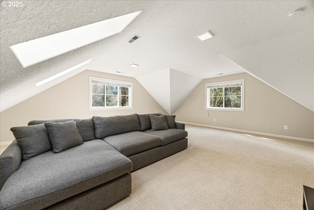 4679 Dogwood Dr, Lake Oswego, OR 97035 - living room with a skylight, plenty of natural light, a textured ceiling, carpet floors, and vaulted ceiling