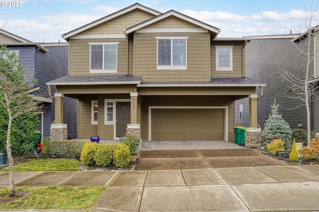 craftsman-style home featuring an attached garage, central AC, covered porch, and concrete driveway