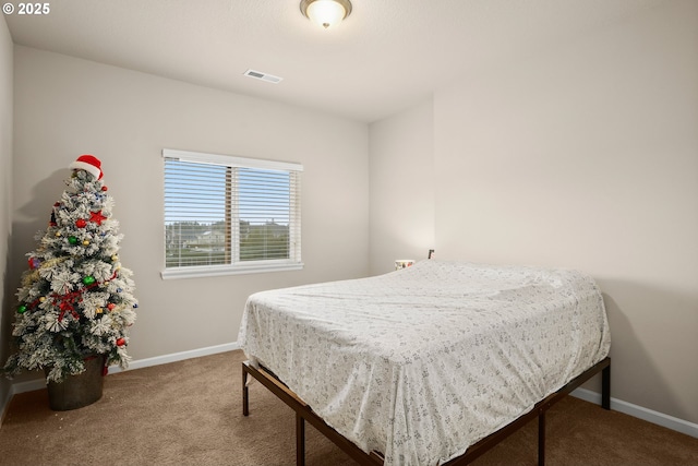 bedroom featuring carpet floors, baseboards, and visible vents