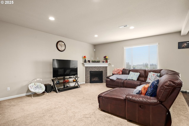 living area featuring visible vents, a tiled fireplace, carpet floors, baseboards, and recessed lighting
