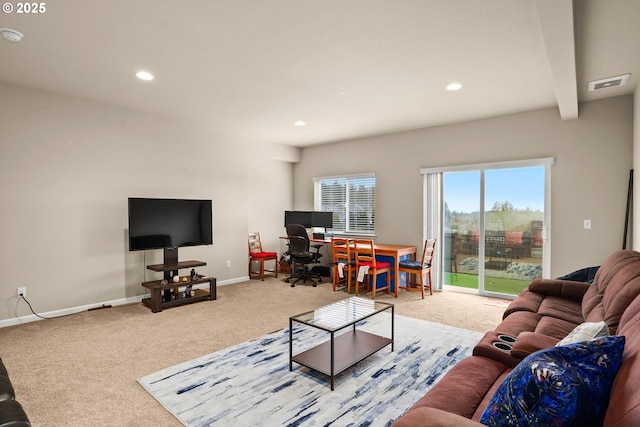 carpeted living area with baseboards, recessed lighting, and visible vents