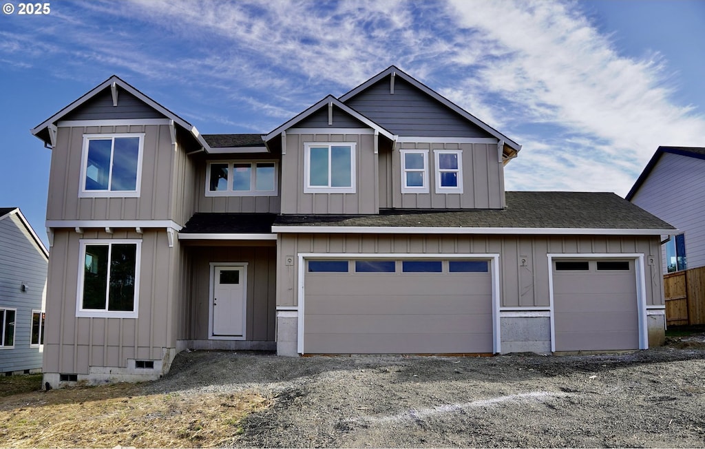 777 Riley Dr, Silverton, OR 97381 - view of front of home featuring a shingled roof, driveway, and board and batten siding