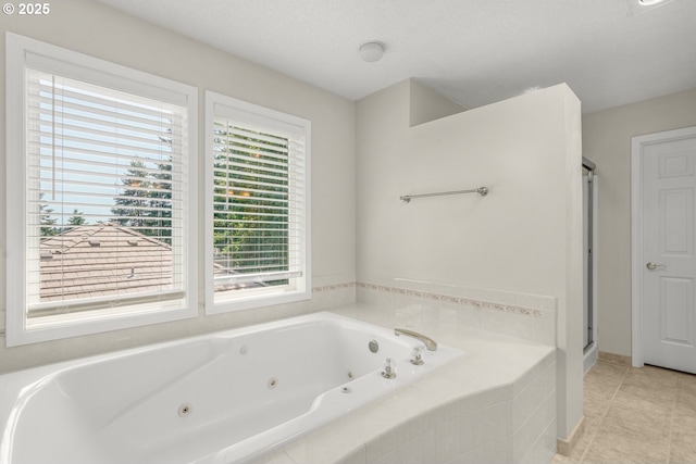 3852 Fairhaven Dr, West Linn, OR 97068 - full bathroom with healthy amount of natural light, a tub with jets, a stall shower, and tile patterned floors