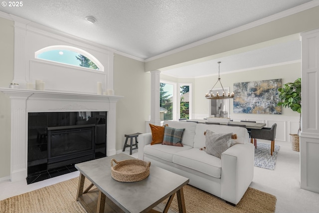 3852 Fairhaven Dr, West Linn, OR 97068 - living area featuring plenty of natural light, light colored carpet, a fireplace with flush hearth, a textured ceiling, and wainscoting
