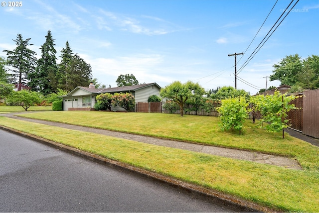13140 SW Edgewood St, Portland, OR 97225 - view of front of house with a garage, driveway, and a chimney