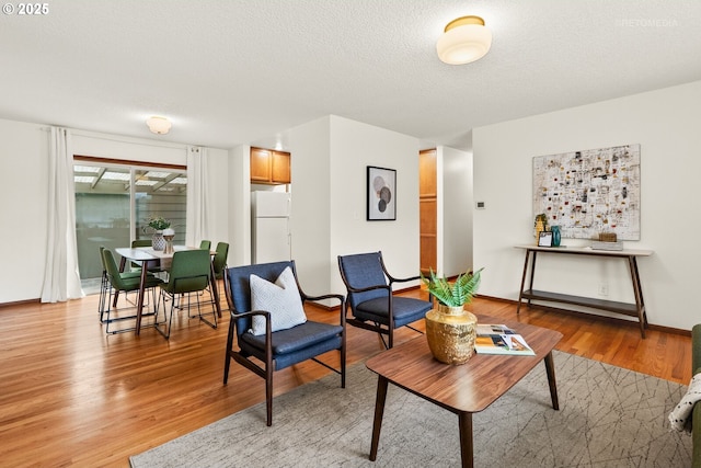 13140 SW Edgewood St, Portland, OR 97225 - living room featuring light wood finished floors and a textured ceiling