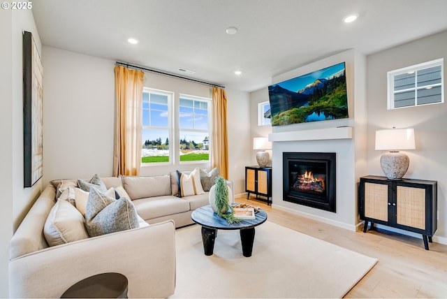 966 Legacy Ln, Eugene, OR 97402 - living room with wood finished floors, recessed lighting, and a glass covered fireplace