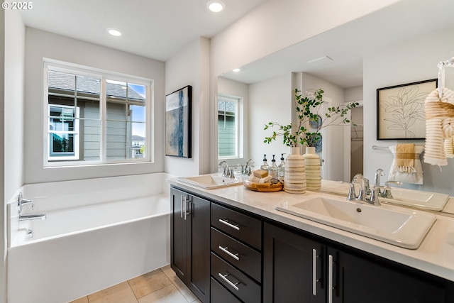 966 Legacy Ln, Eugene, OR 97402 - full bathroom with double vanity, a garden tub, tile patterned flooring, and recessed lighting