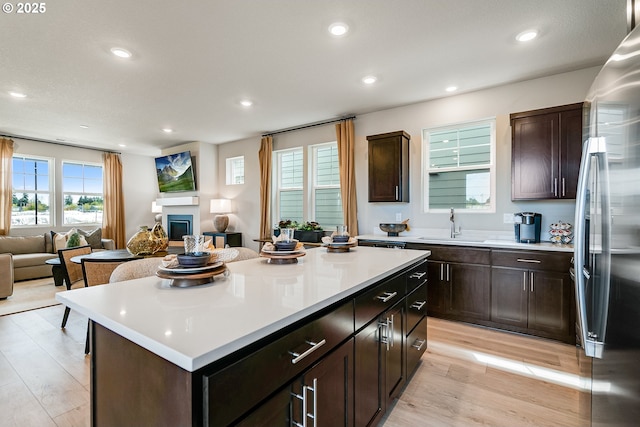 966 Legacy Ln, Eugene, OR 97402 - kitchen with freestanding refrigerator, open floor plan, light countertops, light wood-type flooring, and recessed lighting