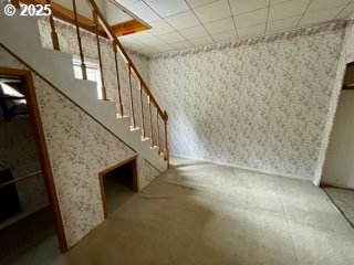 313 Taylor St, Ryderwood, WA 98581 - basement with stairs and wallpapered walls