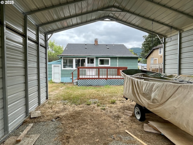 313 Taylor St, Ryderwood, WA 98581 - back of property featuring a chimney, a wooden deck, and a shingled roof