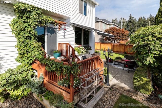 wooden deck featuring a patio area