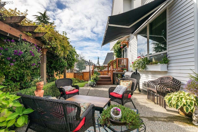 view of patio with outdoor lounge area and a deck