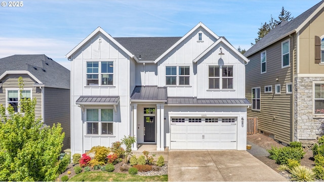 modern inspired farmhouse with board and batten siding, a standing seam roof, an attached garage, and driveway