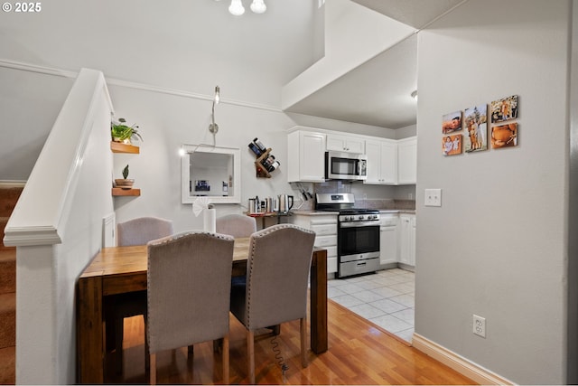17881 SW Pars Pl, Beaverton, OR 97078 - dining room with light tile patterned floors and baseboards