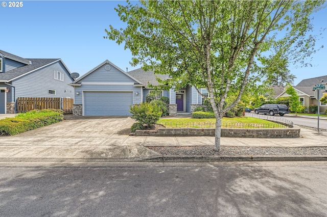 4202 SE 31st St, Gresham, OR 97080 - view of front of property with a garage, concrete driveway, and stone siding