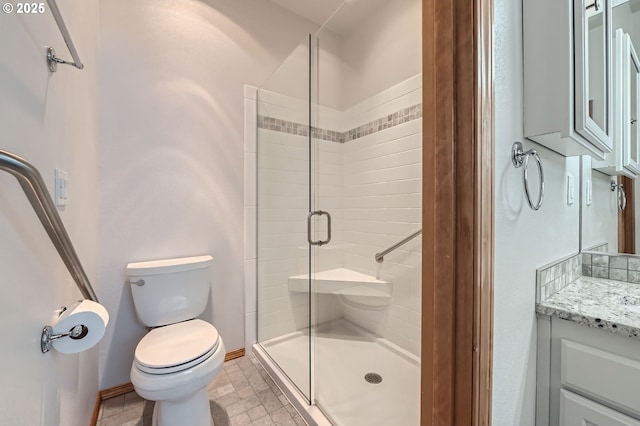 4202 SE 31st St, Gresham, OR 97080 - bathroom with toilet, a stall shower, vanity, and baseboards