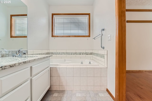 4202 SE 31st St, Gresham, OR 97080 - full bathroom featuring vanity, a garden tub, and plenty of natural light