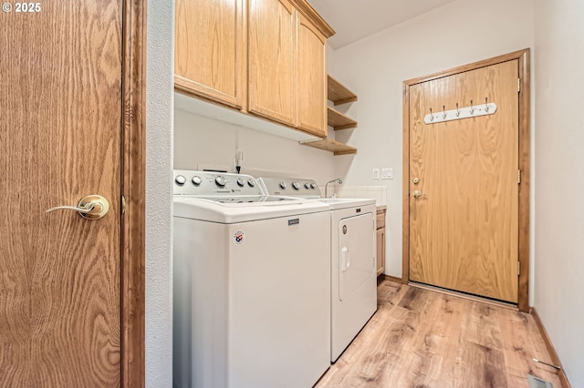4202 SE 31st St, Gresham, OR 97080 - washroom featuring cabinet space, washer and clothes dryer, and light wood-type flooring
