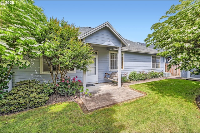 4202 SE 31st St, Gresham, OR 97080 - view of front of house featuring a front yard, central AC, and a patio area