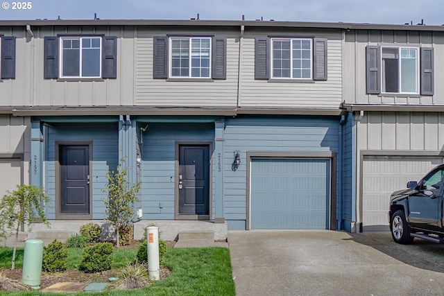 2153 NE 118th Pl, Vancouver, WA 98684 - multi unit property with an attached garage, driveway, and board and batten siding