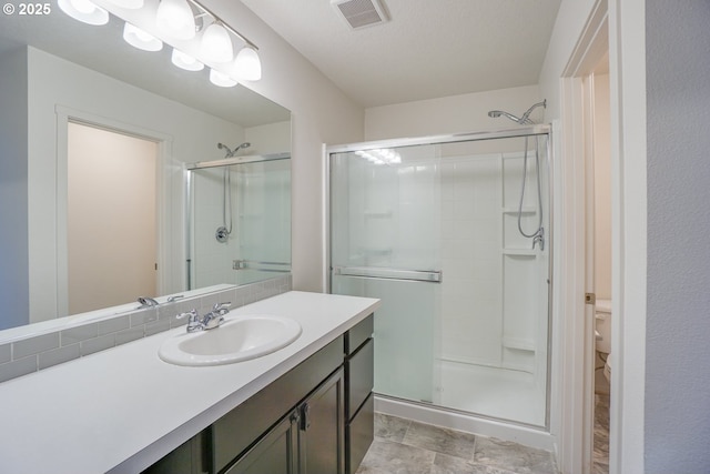 2153 NE 118th Pl, Vancouver, WA 98684 - bathroom featuring a shower stall, vanity, and toilet