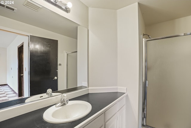 bathroom featuring vanity and walk in shower