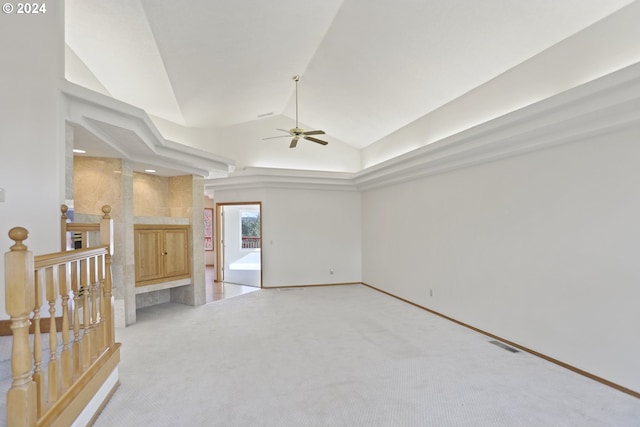 carpeted spare room with lofted ceiling and ceiling fan