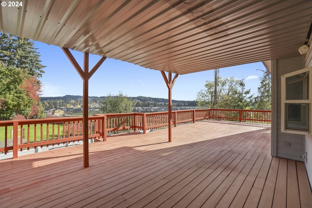 wooden deck featuring a mountain view