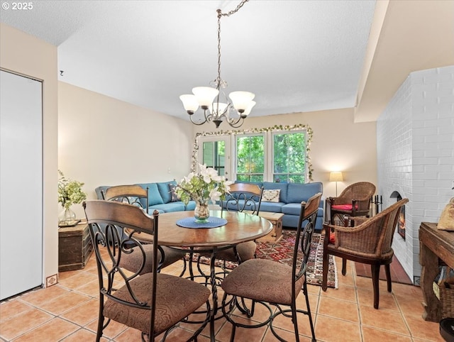 8512 SW Brightfield Cir, Tigard, OR 97223 - dining area featuring a chandelier and light tile patterned flooring
