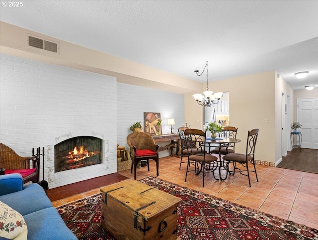 8512 SW Brightfield Cir, Tigard, OR 97223 - tiled living area featuring a chandelier and a brick fireplace