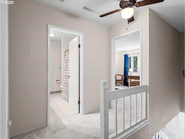 8512 SW Brightfield Cir, Tigard, OR 97223 - corridor with an upstairs landing, carpet flooring, baseboards, and a textured ceiling